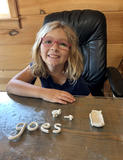 Hands shaping clay during a creative dyslexia learning activity